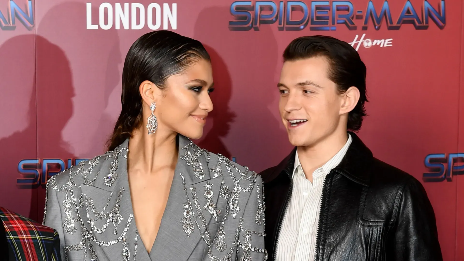 Zendaya and Tom Holland attend a photocall for “Spiderman: No Way Home” at The Old Sessions House on December 05, 2021 in London, England. (Photo by Gareth Cattermole/Getty Images)