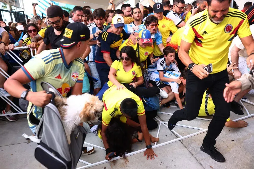 MIAMI GARDENS, FLORIDA – JULY 14: Fans of Colombia and Argentina try to pass the gate amid disturbances the CONMEBOL Copa America 2024 Final match between Argentina and Colombia at Hard Rock Stadium on July 14, 2024 in Miami Gardens, Florida. (Photo by Maddie Meyer/Getty Images)
