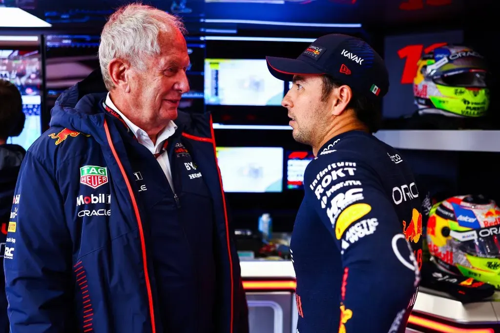 ZANDVOORT, NETHERLANDS – AUGUST 26: Sergio Perez of Mexico and Oracle Red Bull Racing talks with Red Bull Racing Team Consultant Dr Helmut Marko in the garage during qualifying ahead of the F1 Grand Prix of The Netherlands at Circuit Zandvoort on August 26, 2023 in Zandvoort, Netherlands. (Photo by Mark Thompson/Getty Images)