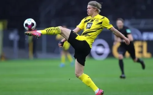 # (L) in action against # (R) during the German Bundesliga soccer match between Borussia Dortmund and Arminia Bielefeld at Signal Iduna Park in Dortmund, Germany, 27 February 2021.-Not Released (NR) DFL regulations prohibit any use of photographs as image sequences and/or quasi-video.