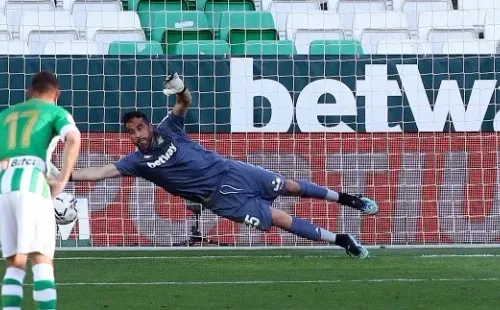 SEVILLE, SPAIN - APRIL 18: Claudio Bravo of Real Betis fails to save as Carlos Soler of Valencia CF scores their team's second goal from the penalty spot during the La Liga Santander match between Real Betis and Valencia CF at Estadio Benito Villamarin on April 18, 2021 in Seville, Spain. Sporting stadiums around Spain remain under strict restrictions due to the Coronavirus Pandemic as Government social distancing laws prohibit fans inside venues resulting in games being played behind closed doors. (Photo by Fran Santiago/Getty Images)-Not Released (NR)