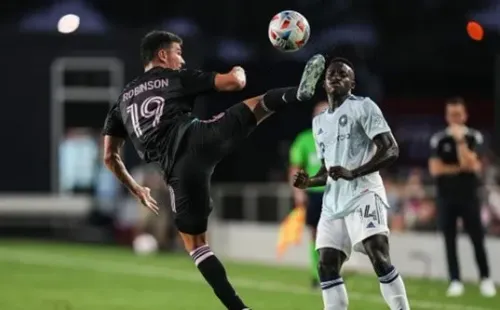 FORT LAUDERDALE, FLORIDA - AUGUST 18: Robbie Robinson #19 of Inter Miami CF kicks the ball up the field against Jhon Espinoza #14 of Chicago Fire FC during the first half at DRV PNK Stadium on August 18, 2021 in Fort Lauderdale, Florida. (Photo by Mark Brown/Getty Images)