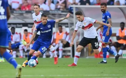 STUTTGART, GERMANY - SEPTEMBER 19: Charles Aranguiz of Bayer 04 Leverkusen and Oemer Faruk Beyaz of VfB Stuttgart compete for the ball during the Bundesliga match between VfB Stuttgart and Bayer 04 Leverkusen at Mercedes-Benz Arena on September 19, 2021 in Stuttgart, Germany. (Photo by Sebastian Widmann/Getty Images)-Not Released (NR) DFL regulations prohibit any use of photographs as image sequences and/or quasi-video.