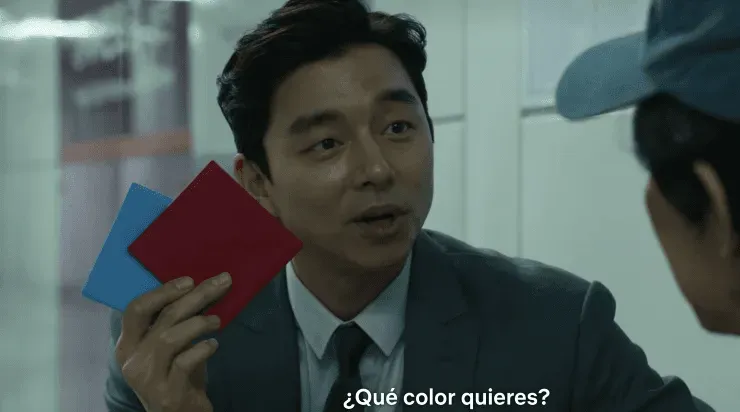 El misterioso hombre del maletín, actor que recordarás de Estación Zombie, incluso le da la opción de escoger el sobre. (Foto: Netflix)