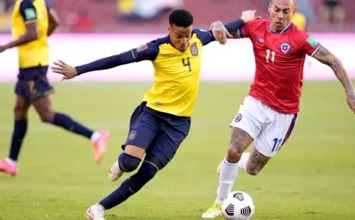 QUITO, ECUADOR - SEPTEMBER 05: Byron Castillo (C) of Ecuador competes for the ball with Eduardo Vargas (R) of Chile during a match between Ecuador and Chile as part of South American Qualifiers for Qatar 2022 at Rodrigo Paz Delgado Stadium on September 05, 2021 in Quito, Ecuador. (Photo by Dolores Ochoa - Pool/Getty Images)-Not Released (NR)