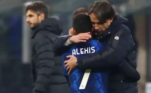 MILAN, ITALY - DECEMBER 12: Alexis Sanchez of Internazionale hugs Simone Inzaghi, Head Coach Internazionale during the Serie A match between FC Internazionale and Cagliari Calcio at Stadio Giuseppe Meazza on December 12, 2021 in Milan, Italy. (Photo by Marco Luzzani/Getty Images)-Not Released (NR)
