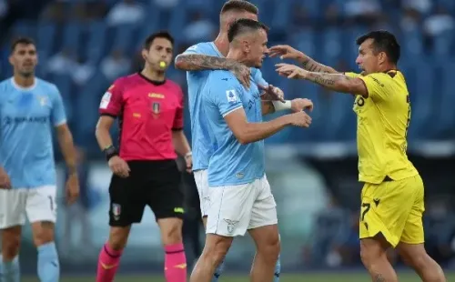 ROME, ITALY - AUGUST 14: Sergej Milinkovic Savic and Patric fight with Alexis Medel of Bologna FC during the Serie A match between SS Lazio and Bologna FC at Stadio Olimpico on August 14, 2022 in Rome, Italy. (Photo by Paolo Bruno/Getty Images)-Not Released (NR)