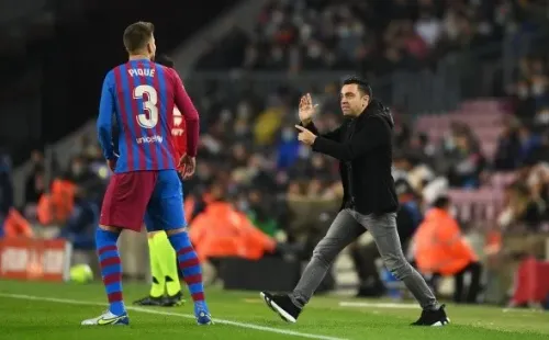 Gerard Piqué y Xavi Hernández