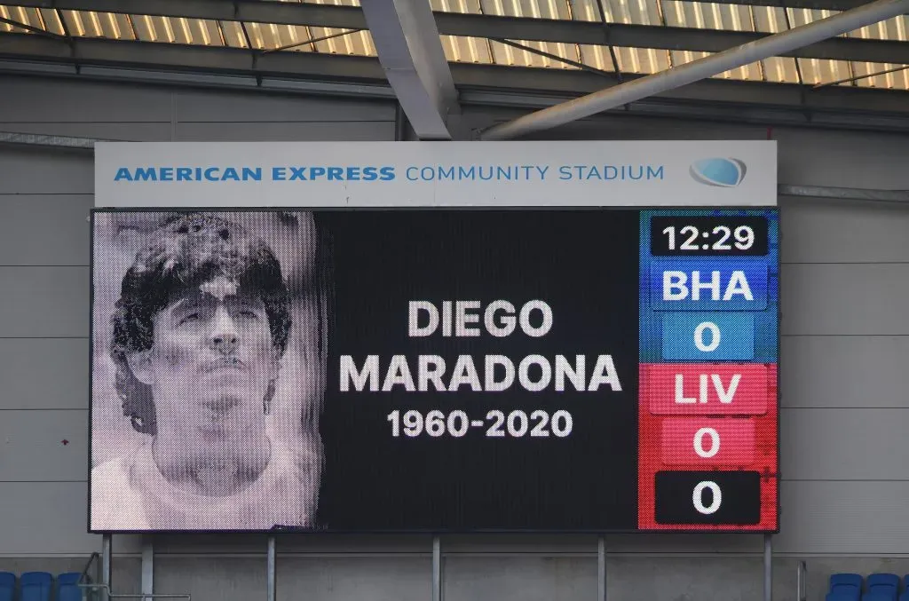 BRIGHTON, ENGLAND – NOVEMBER 28: The big screen displays a picture in memory of Diego Maradona prior to the Premier League match between Brighton & Hove Albion and Liverpool at American Express Community Stadium on November 28, 2020 in Brighton, England. Sporting stadiums around the UK remain under strict restrictions due to the Coronavirus Pandemic as Government social distancing laws prohibit fans inside venues resulting in games being played behind closed doors. (Photo by Mike Hewitt/Getty Images)