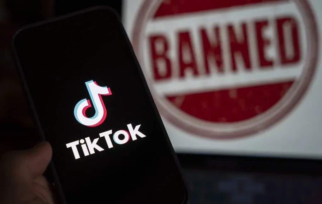 April 25, 2024: In this photo illustration, logo of Tiktok is displayed on mobile phone screen next to ban sign, in Guwahati, India 25 April 2024. US President Joe Biden signs law to ban Chinese-owned TikTok unless sold to US company.
