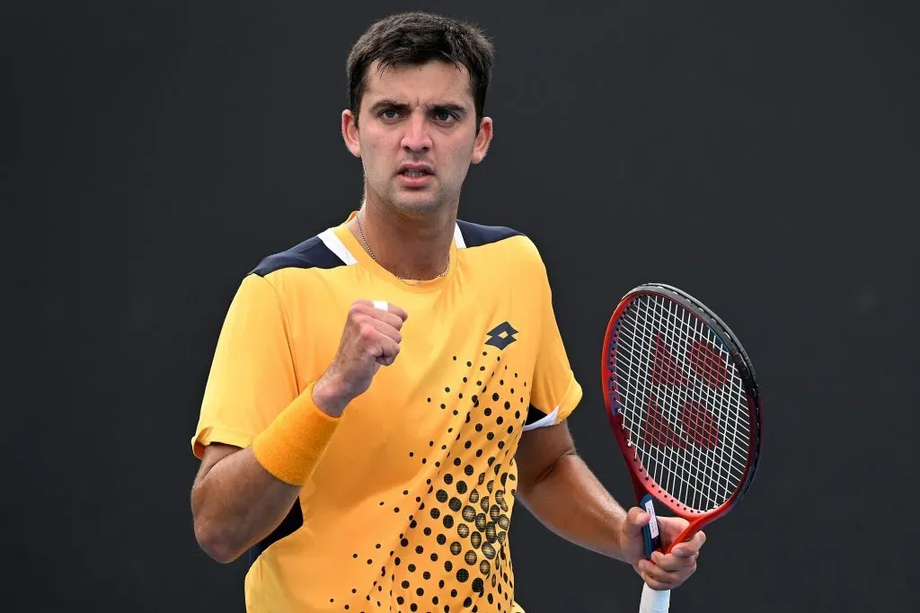 MELBOURNE, AUSTRALIA – JANUARY 18: Tomas Barrios Vera of Chile celebrates after winning a point in his first round singles match against Taro Daniel of Japan during day two of the 2022 Australian Open at Melbourne Park on January 18, 2022 in Melbourne, Australia. (Photo by Quinn Rooney/Getty Images)