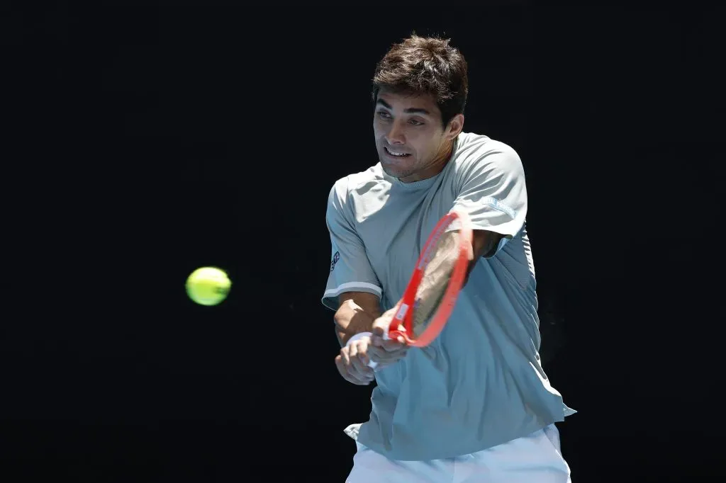 MELBOURNE, AUSTRALIA – JANUARY 16: Cristian Garin of Chile plays a backhand against Taylor Fritz of the United States in the Men’s Singles Second Round match during day five of the 2025 Australian Open at Melbourne Park on January 16, 2025 in Melbourne, Australia. (Photo by Daniel Pockett/Getty Images)