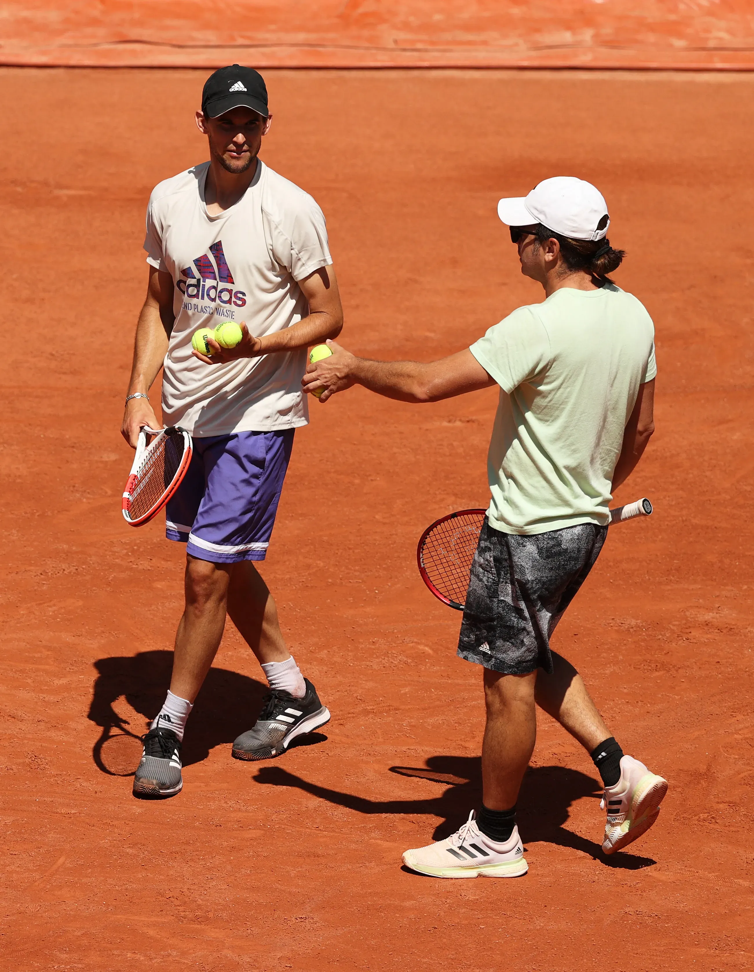 Dominic Thiem entrenando con Nicolás Massú. (Photo by Clive Brunskill/Getty Images)