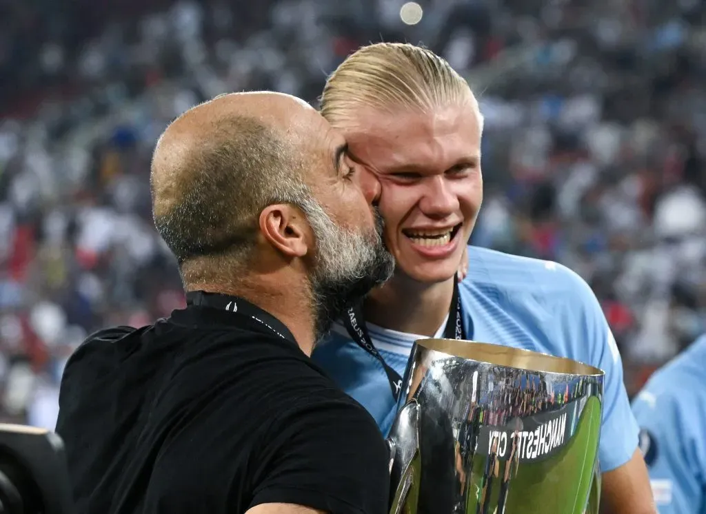 PIRAEUS, GREECE – AUGUST 16: Pep Guardiola, Manager of Manchester City, kisses Erling Haaland after the team’s victory in the UEFA Super Cup 2023 match between Manchester City FC and Sevilla FC at Karaiskakis Stadium on August 16, 2023 in Piraeus, Greece. (Photo by Claudio Villa/Getty Images)