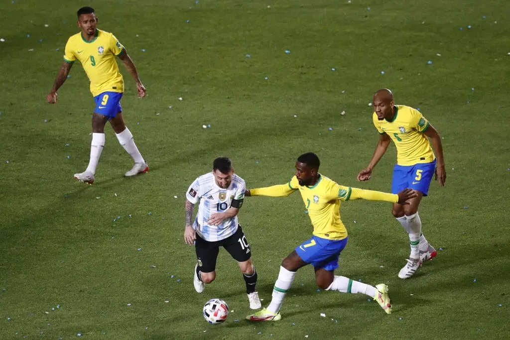 SAN JUAN, ARGENTINA – NOVEMBER 16: Lionel Messi of Argentina competes for the ball with Gerson of Brazil during a match between Argentina and Brazil as part of FIFA World Cup Qatar 2022 Qualifiers at San Juan del Bicentenario Stadium on November 16, 2021 in San Juan, Argentina. (Photo by Marcos Brindicci/Getty Images)