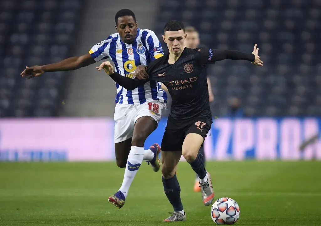 Phil Foden of Manchester City is challenged by Wilson Manafa of FC Porto. (Photo by Octavio Passos/Getty Images)
