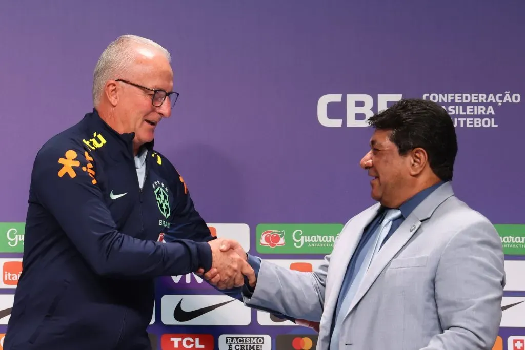 Dorival Junior shakes hands with Ednaldo Rodrigues, president of CBF, (Photo by Lucas Figueiredo/Getty Images)