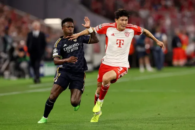 Vinicius Junior of Real Madrid and Kim Min-Jae of Bayern Munich (Photo by Alexander Hassenstein/Getty Images)