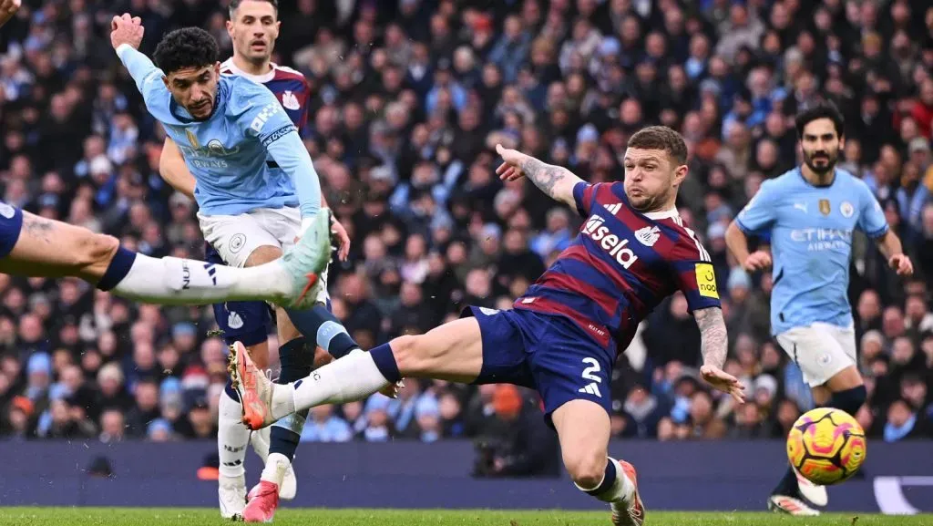 Omar Marmoush of Manchester City scores his team's second goal under pressure from Kieran Trippier of Newcastle United during the Premier League match between Manchester City FC and Newcastle United FC at Etihad Stadium on February 15, 2025 in Manchester, England. (Photo by Stu ForsterGetty Images)