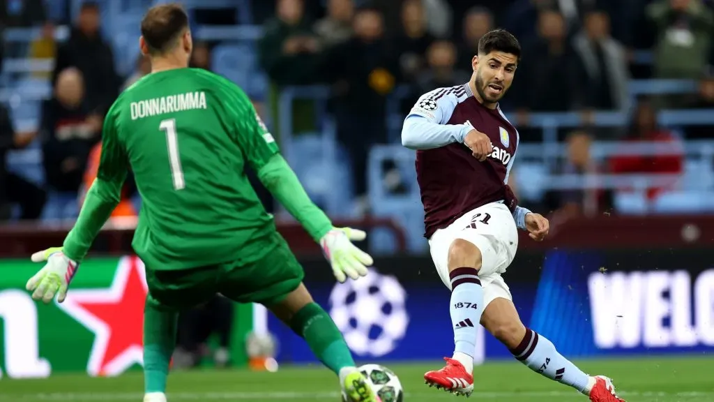 Defesa de Donnarumma em chute de Marco Asensio. Foto: Dan Istitene/Getty Images