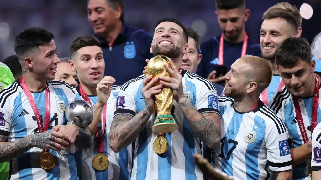 LUSAIL CITY, QATAR – DECEMBER 18: Nicolas Otamendi of Argentina lifts the FIFA World Cup Qatar 2022 Winner’s Trophy during the FIFA World Cup Qatar 2022 Final match between Argentina and France at Lusail Stadium on December 18, 2022 in Lusail City, Qatar. (Photo by Julian Finney/Getty Images)
