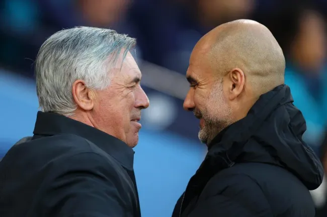 Carlo Ancelotti e Pep Guardiola. Foto: Catherine Ivill/Getty Images.