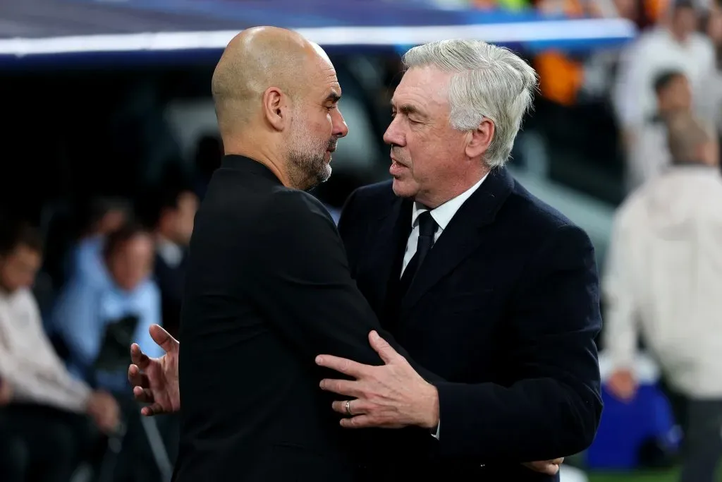 Pep Guardiola e Carlo Ancelotti, dois dos melhores treinadores da atualidade e de sempre. Foto: Clive Brunskill/Getty Images.