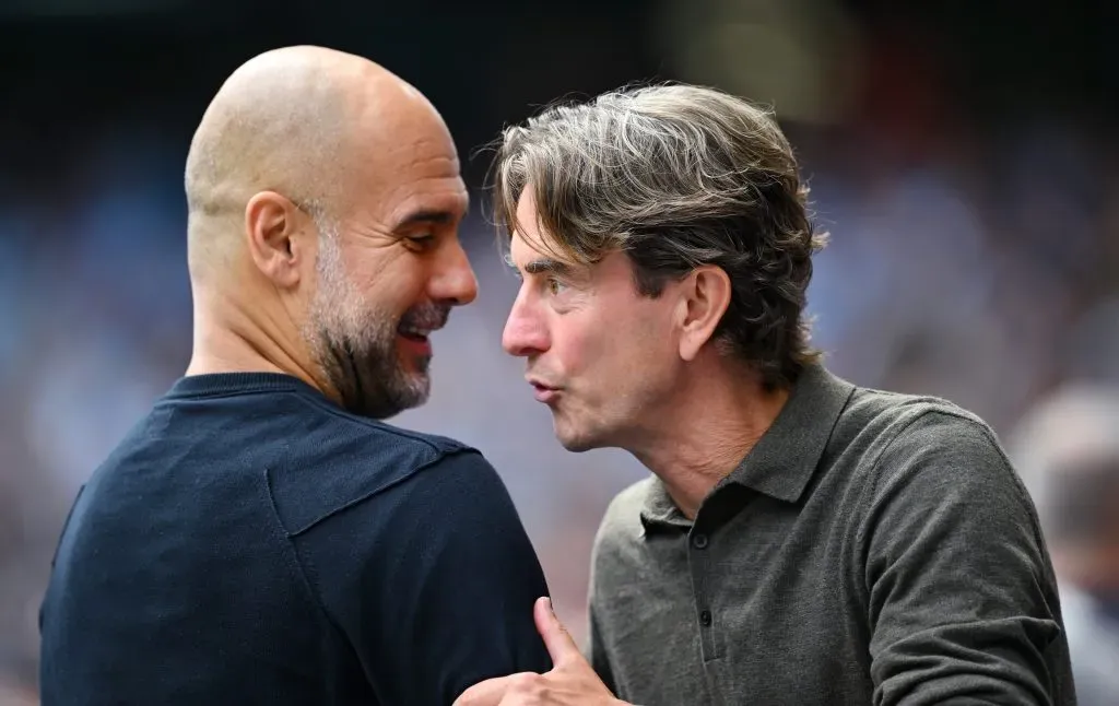 Guardiola e Frank, respetivamente treinadores de City e Tottenham, à conversa. Foto: Clive Mason/Getty Images.