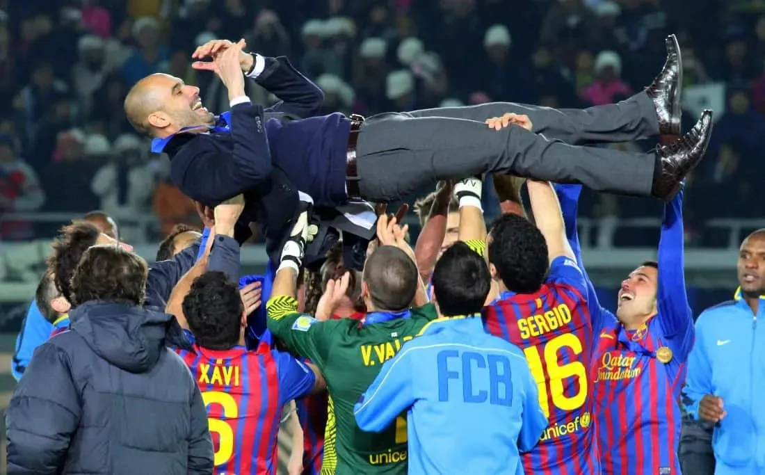 FC Barcelona players lift former manager Pep Guardiola.