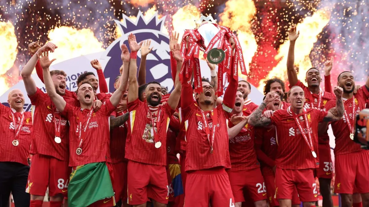 Virgil van Dijk of Liverpool, lifts the Premier League trophy, as Liverpool are crowned the Champions of the Premier League for the 2024/25 Season. (Source: Carl Recine/Getty Images)