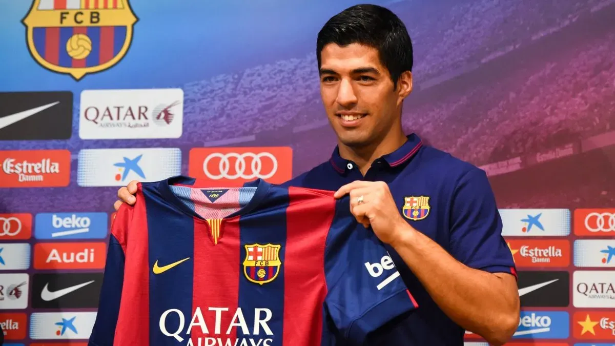 Luis Suarez of FC Barcelona poses for the media during a press conference as part of his presentation as new FC Barcelona player at Camp Nou on August 19, 2014. (Source: David Ramos/Getty Images)
