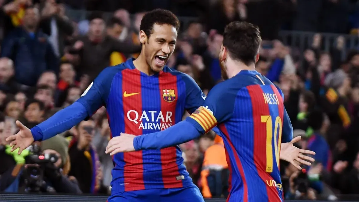Neymar and Messi playing for Barcelona.