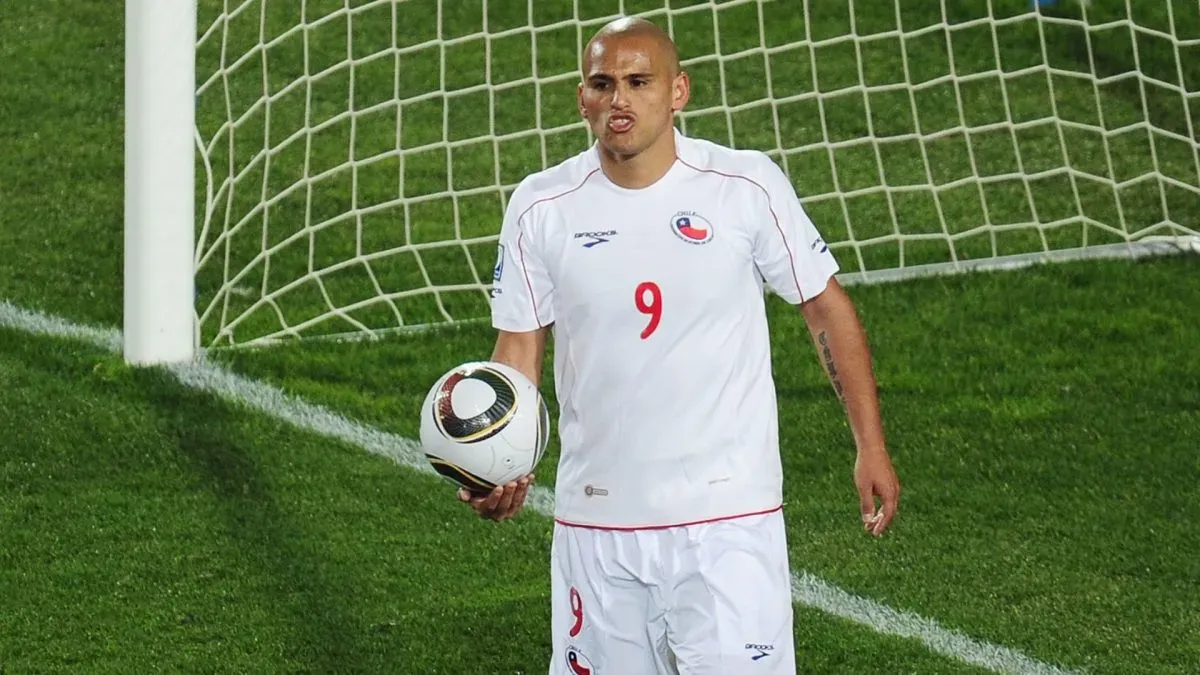 Humberto Suazo picks the ball out of the net during the 2010 FIFA World Cup South Africa Round of Sixteen match. (Source: Clive Mason/Getty Images)