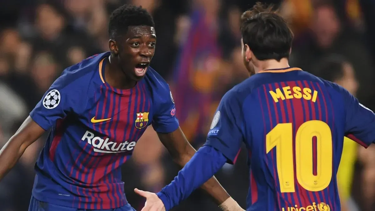 Ousmane Dembele celebrates with Lionel Messi as he scores a goal during the UEFA Champions League match between Barcelona and Chelsea FC on March 14, 2018.