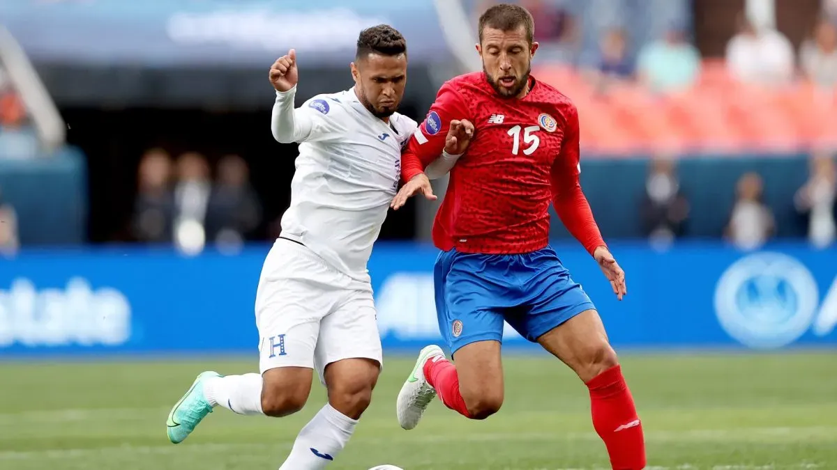 Alexander Lopez #10 of Honduras fights for control of the ball aganst Francisco Calvo #15 of Costa Rica.