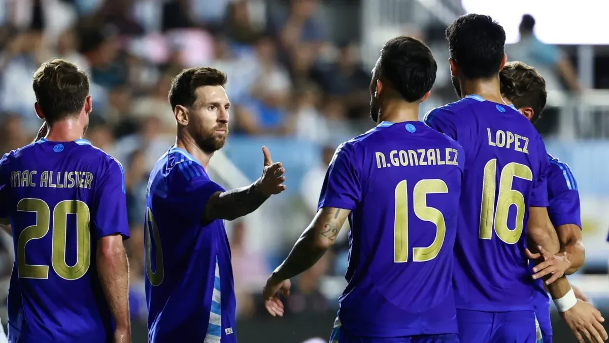 Lionel Messi celebrates Argentina's goal with his teammates.