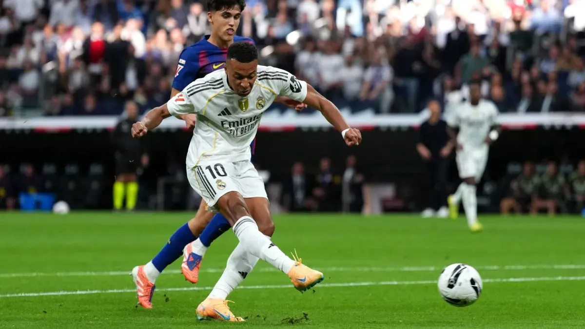 Kylian Mbappe of Real Madrid scores his team's first goal against Barcelona.