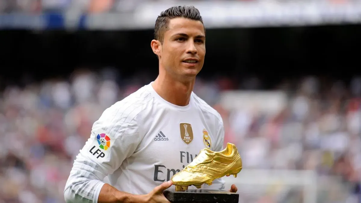 Cristiano Ronaldo of Real Madrid looks on with his Golden Boot award.