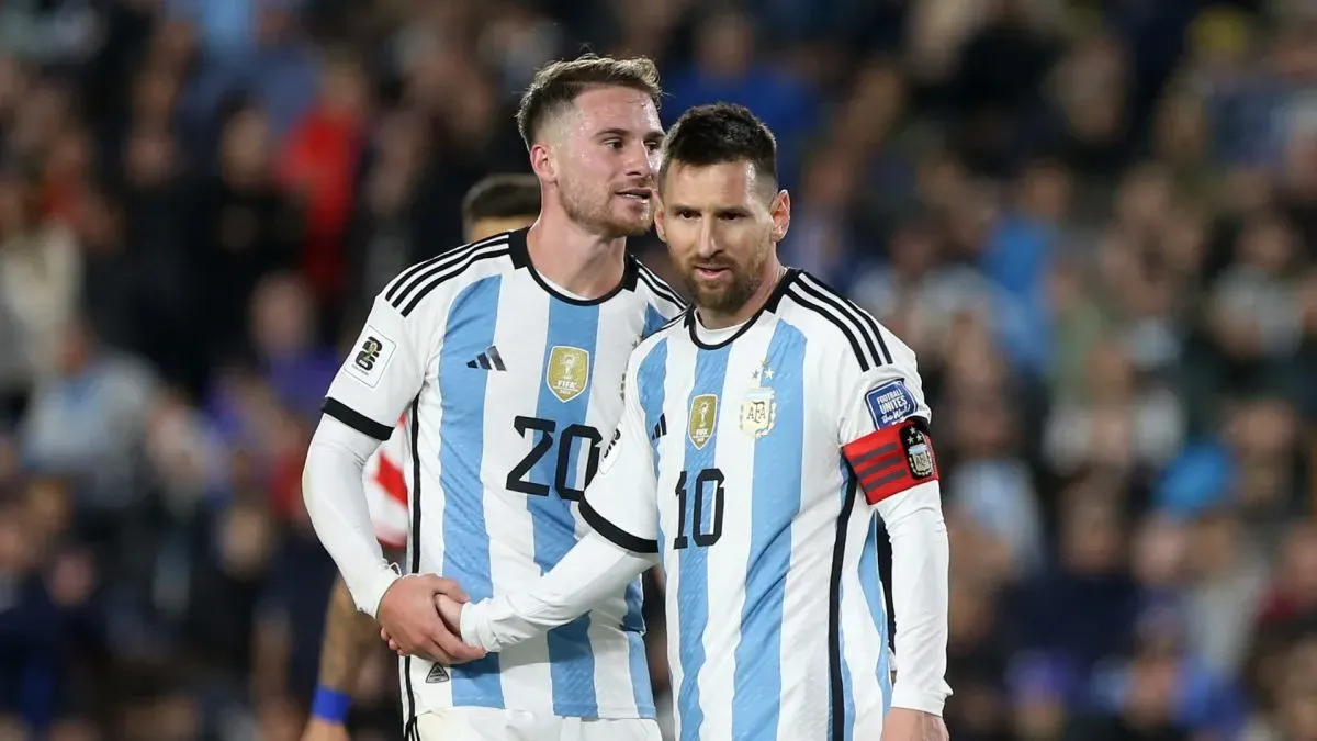 Lionel Messi of Argentina talks to teammate Alexis Mac Allister.