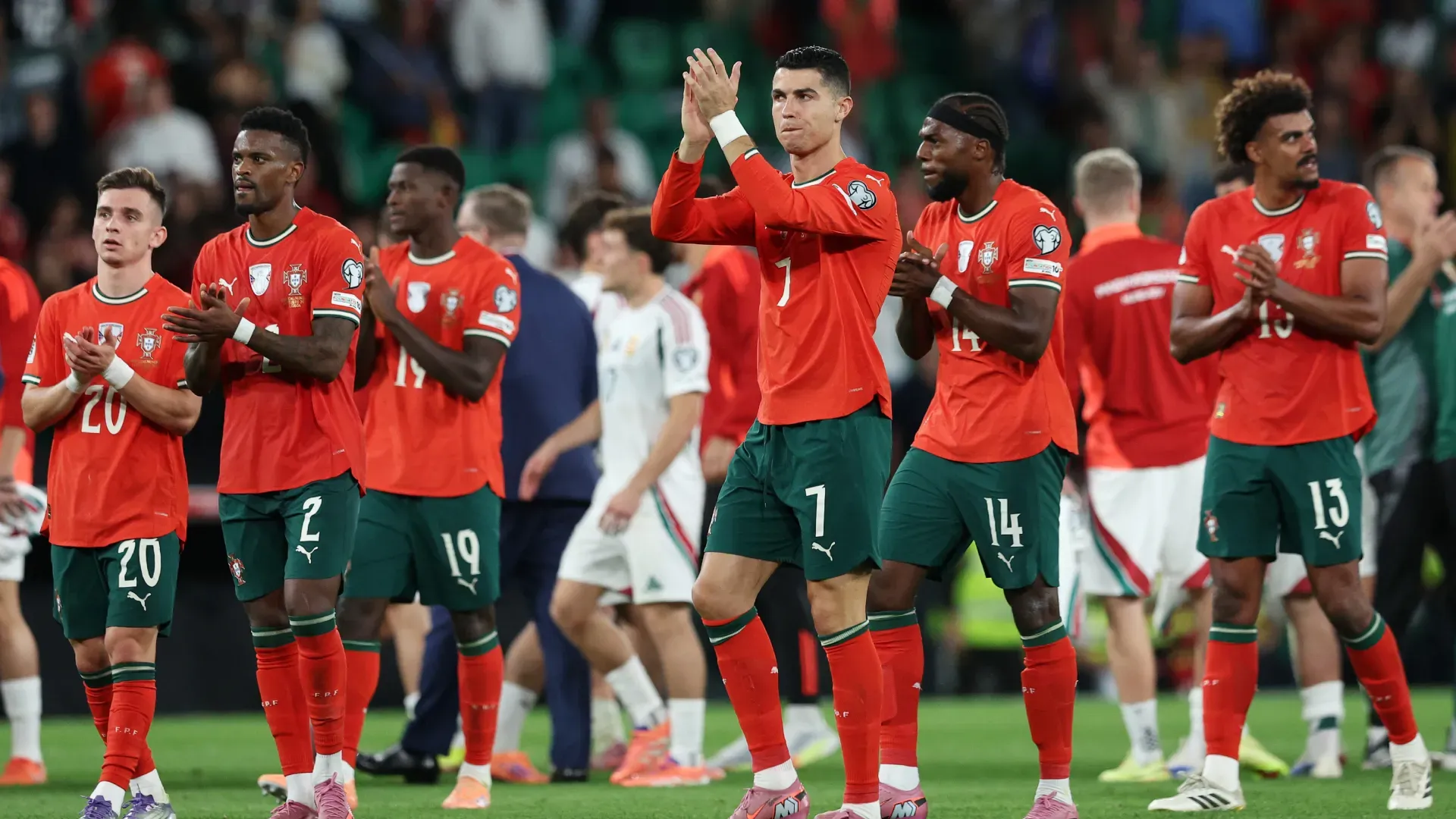 Portugal players applauding fans.
