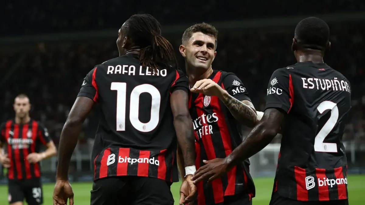 Christian Pulisic of AC Milan celebrates after scoring a goal with Rafael Leao.