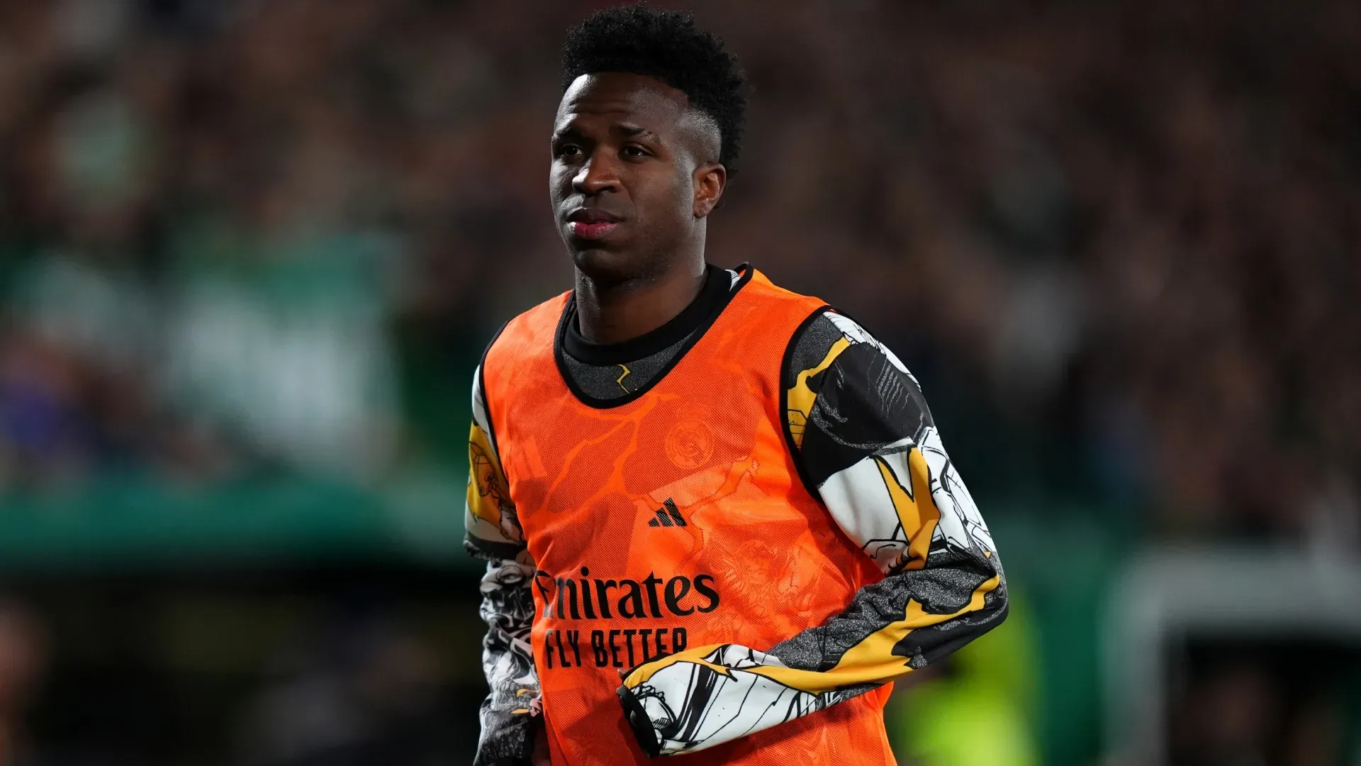 Vinicius Junior of Real Madrid warms up on the sidelines during Elche game.