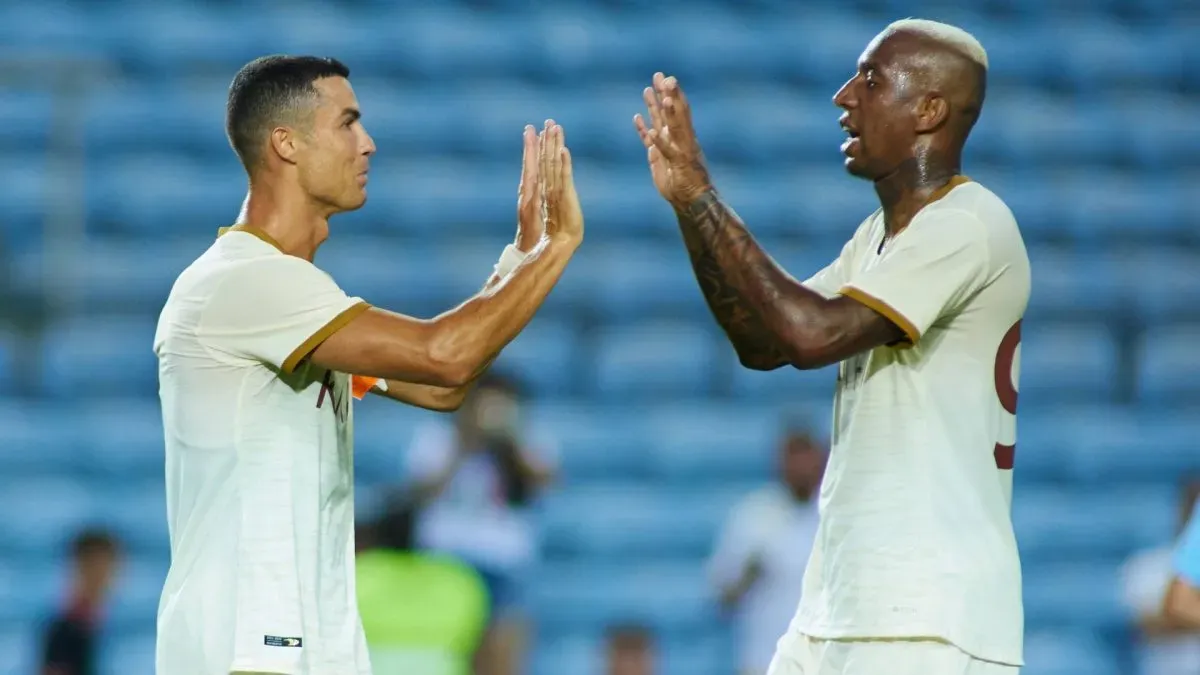 Cristiano Ronaldo and Anderson Talisca celebrate after scoring for Al Nassr.