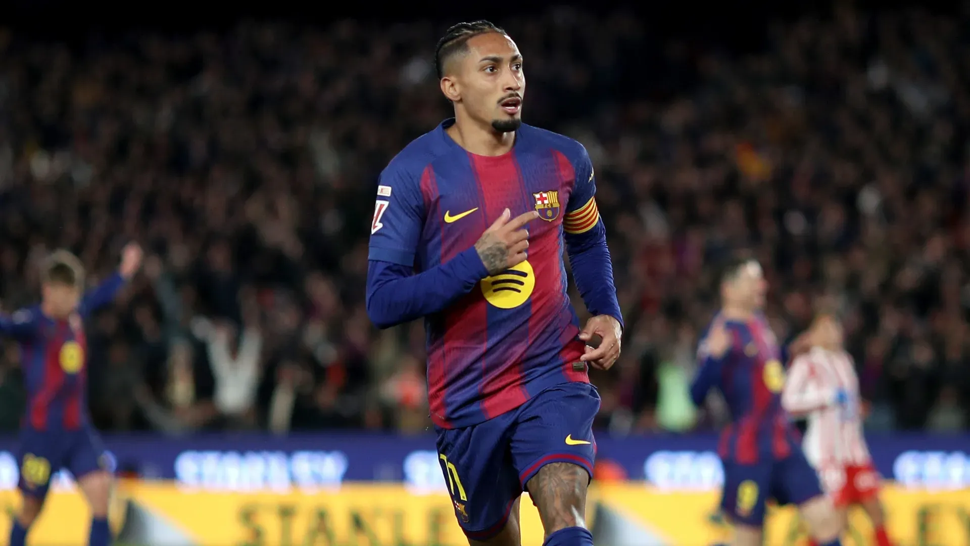 Raphinha of FC Barcelona celebrates scoring against Atletico Madrid.