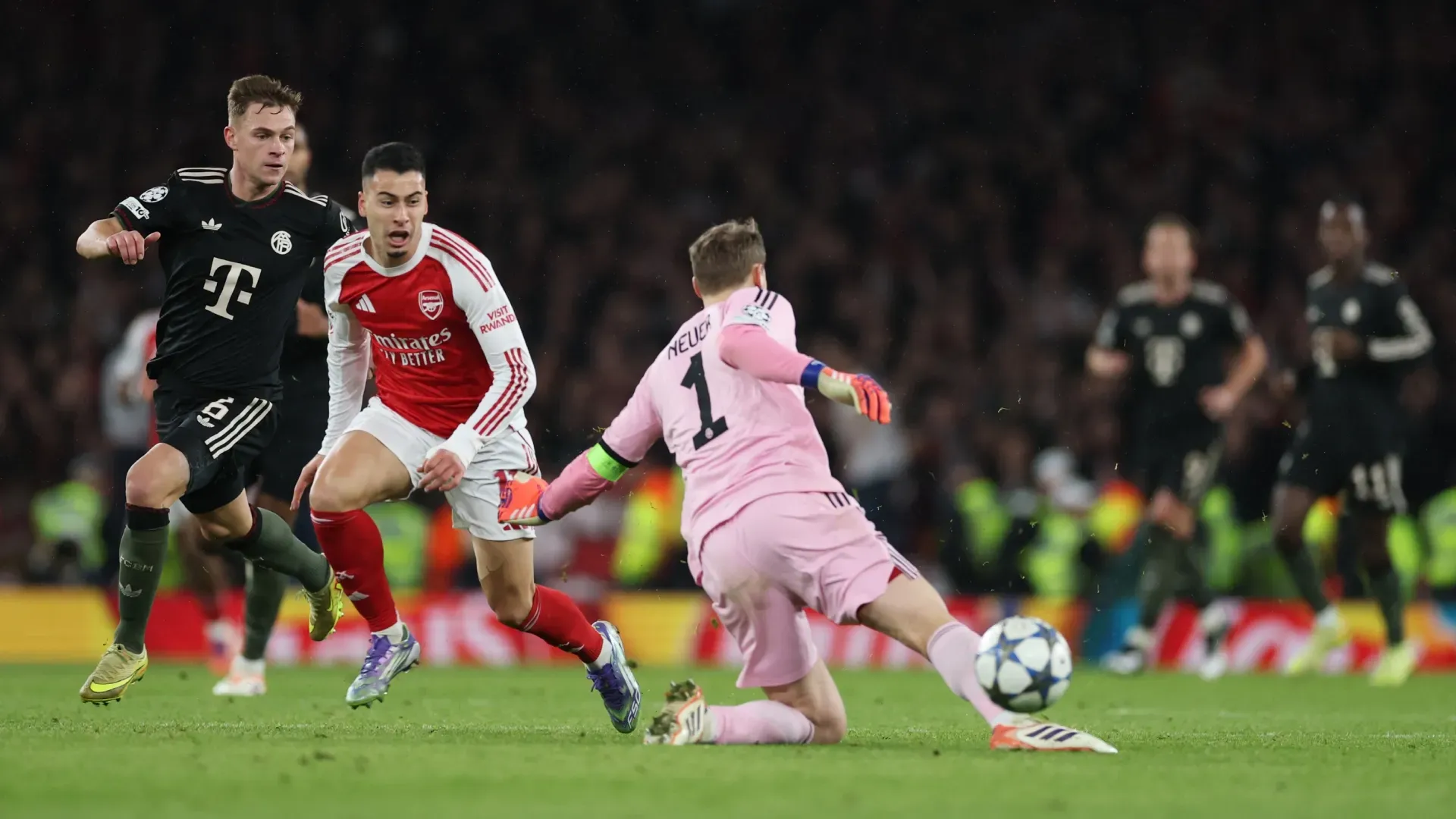 Gabriel Martinelli of Arsenal goes round Manuel Neuer of Bayern Munich to score his team's third goal in the UEFA Champions League.