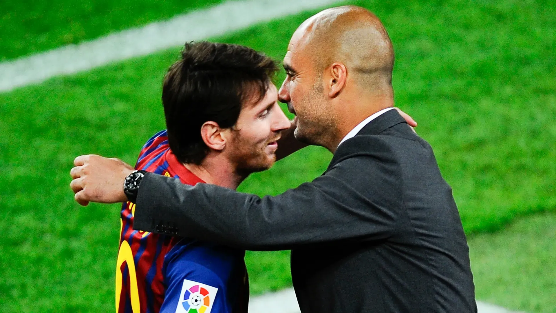 Barcelona's Lionel Messi and Pep Guardiola