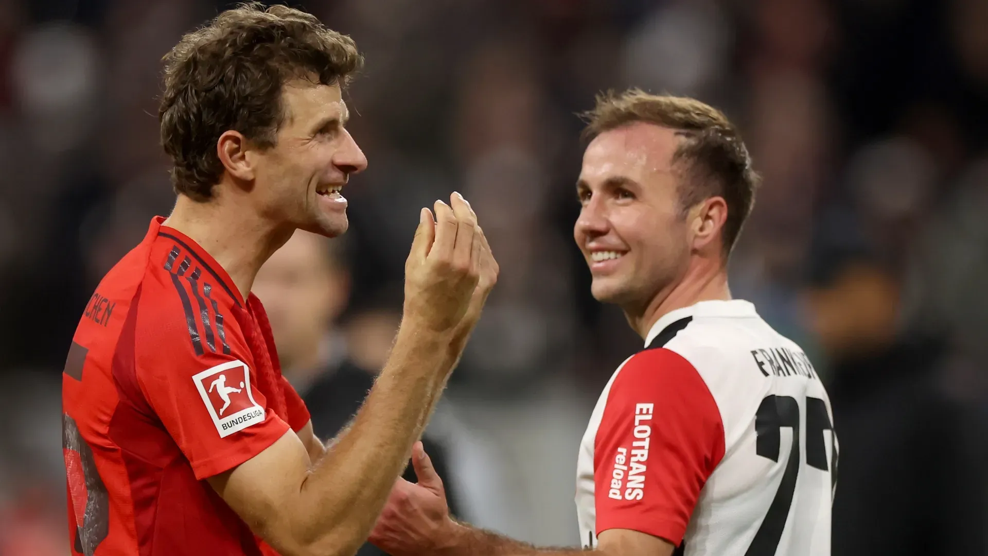 Thomas Mueller of Bayern Munich and Mario Gotze of Eintracht Frankfurt.