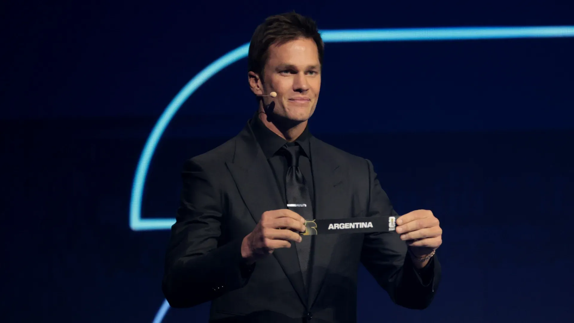 Draw assistant Tom Brady draws out the card of Argentina during the FIFA World Cup 2026 Official Draw.