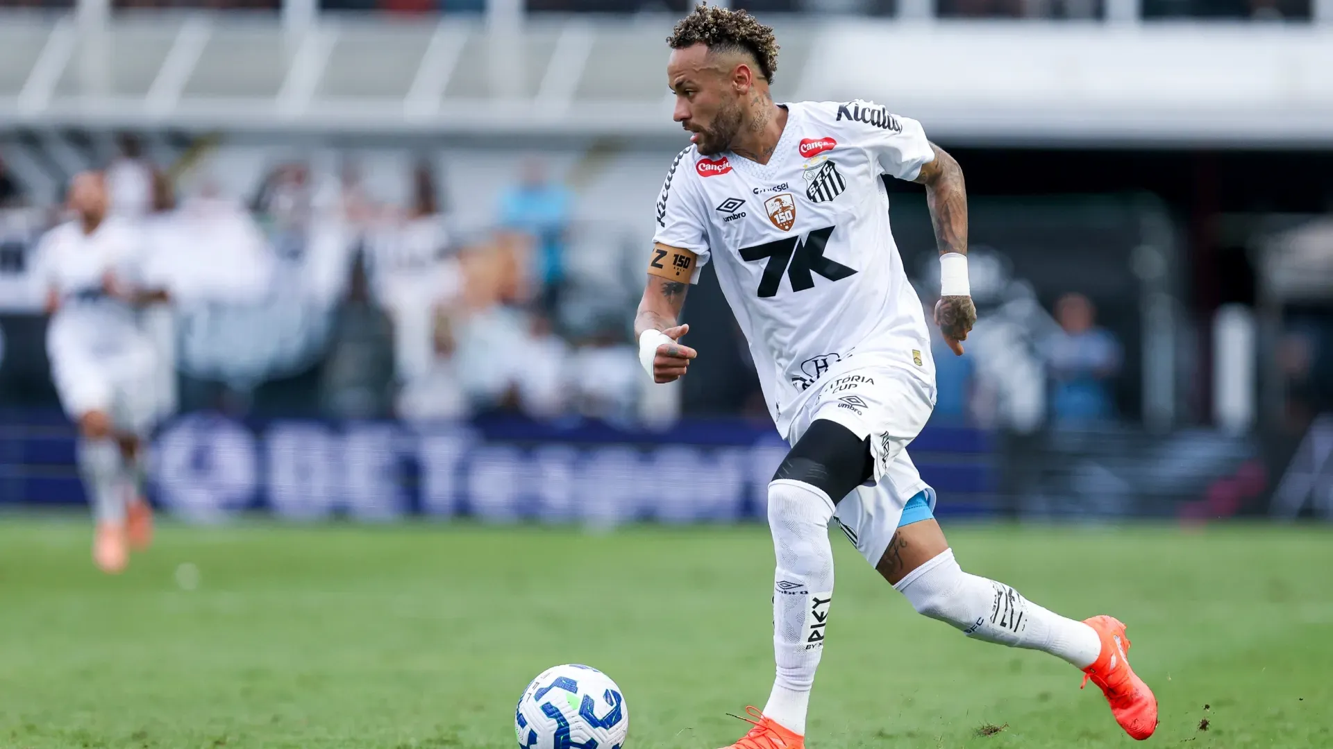 Neymar Junior of Santos runs with the ball against Cruzeiro.