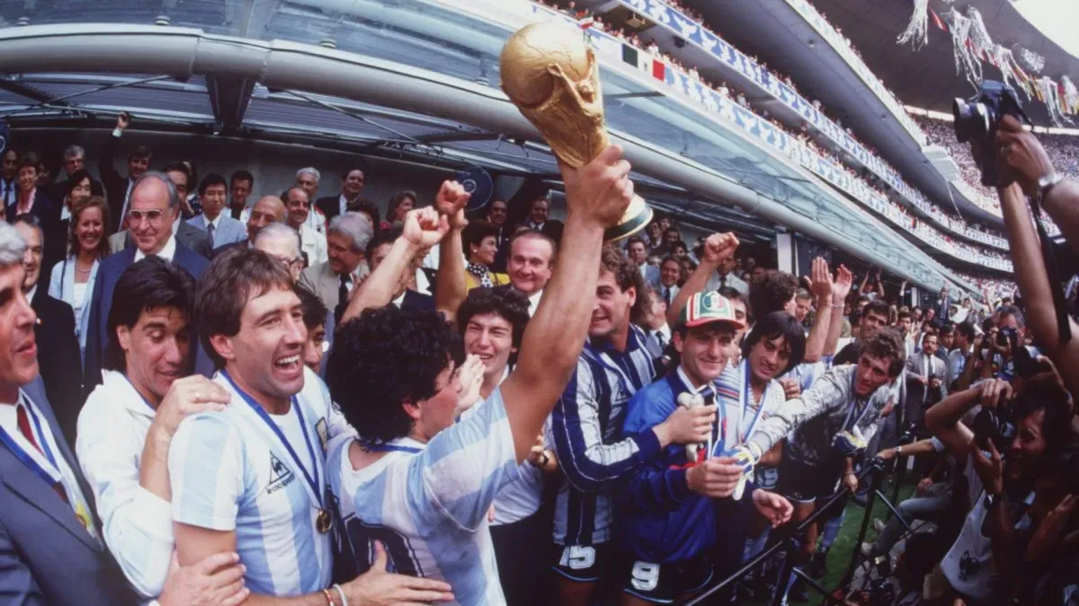 Diego Maradona lifting the 1986 World Cup.